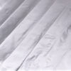 Detailed view of metallic silver foil sheet, designed for electric heating purposes.