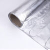 Aluminum foil roll on white surface, used for electric heating foil mat.