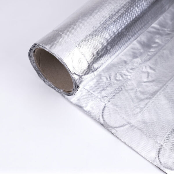 Aluminum foil roll on white surface, used for electric heating foil mat.